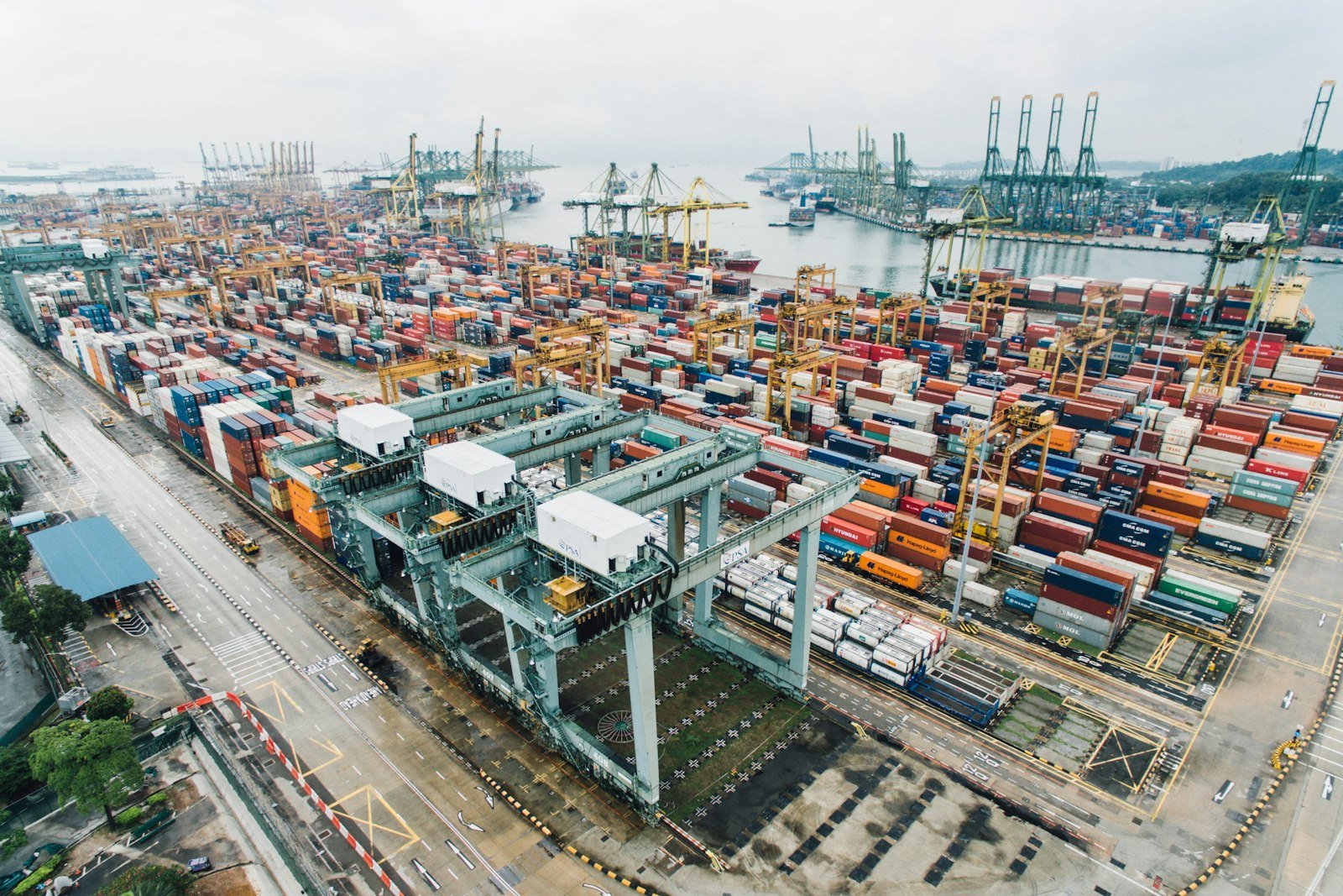 Aerial view of a container terminal with cranes and stacked containers